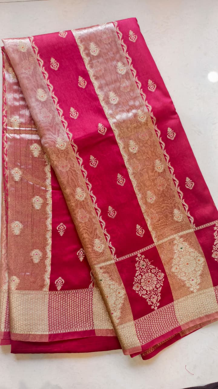 A luxurious Fuchsia Pink Banarasi viscose silk saree featuring intricate all-over Minakari weaving with delicate contrasting accents.