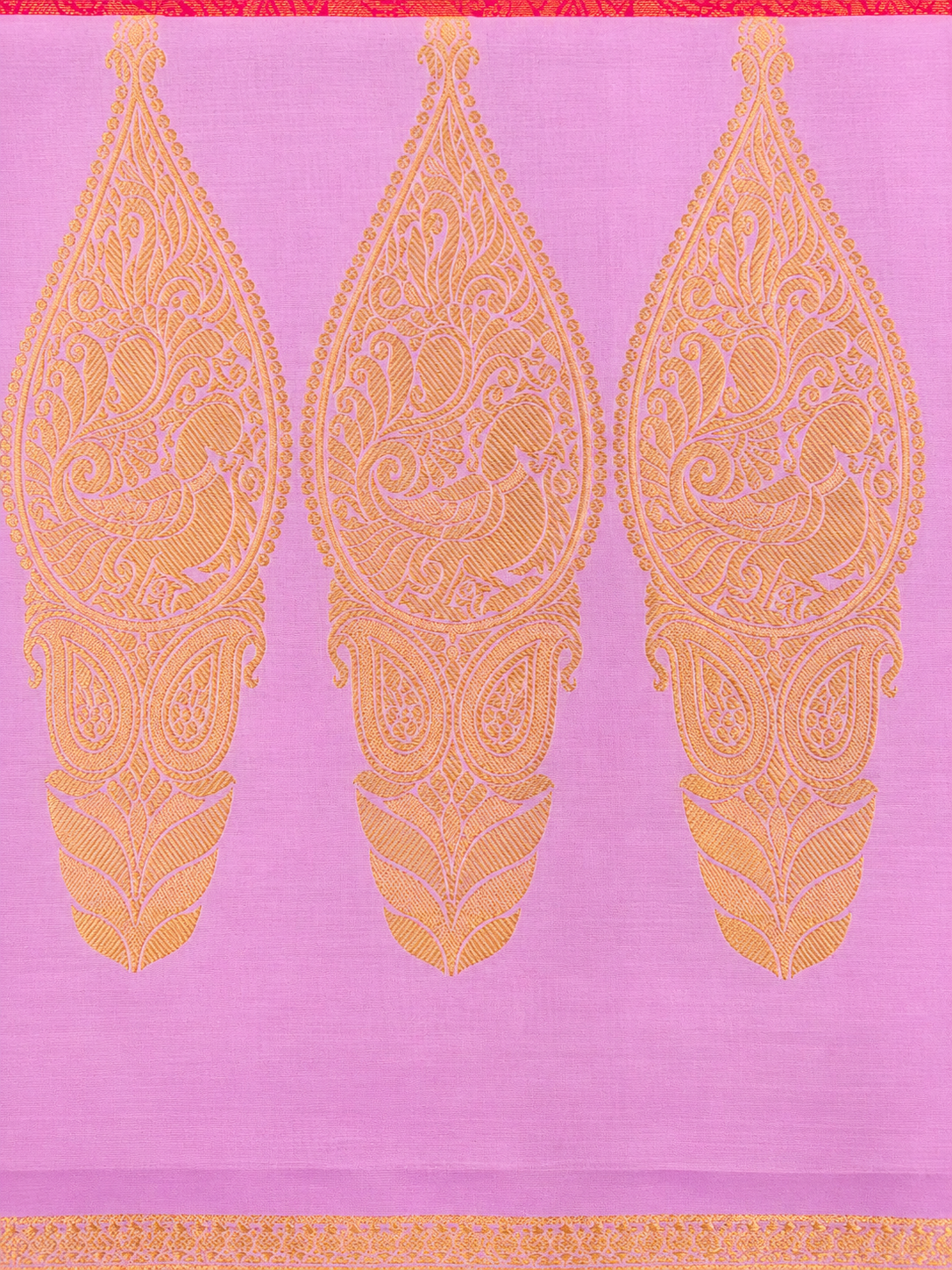 Vibrant Rani Pink Pure Mysore Silk in Mubbagam style, featuring running Peacock zari motifs and an exquisite Leaf-Mango pallu with Peacocks woven within the leaf designs.