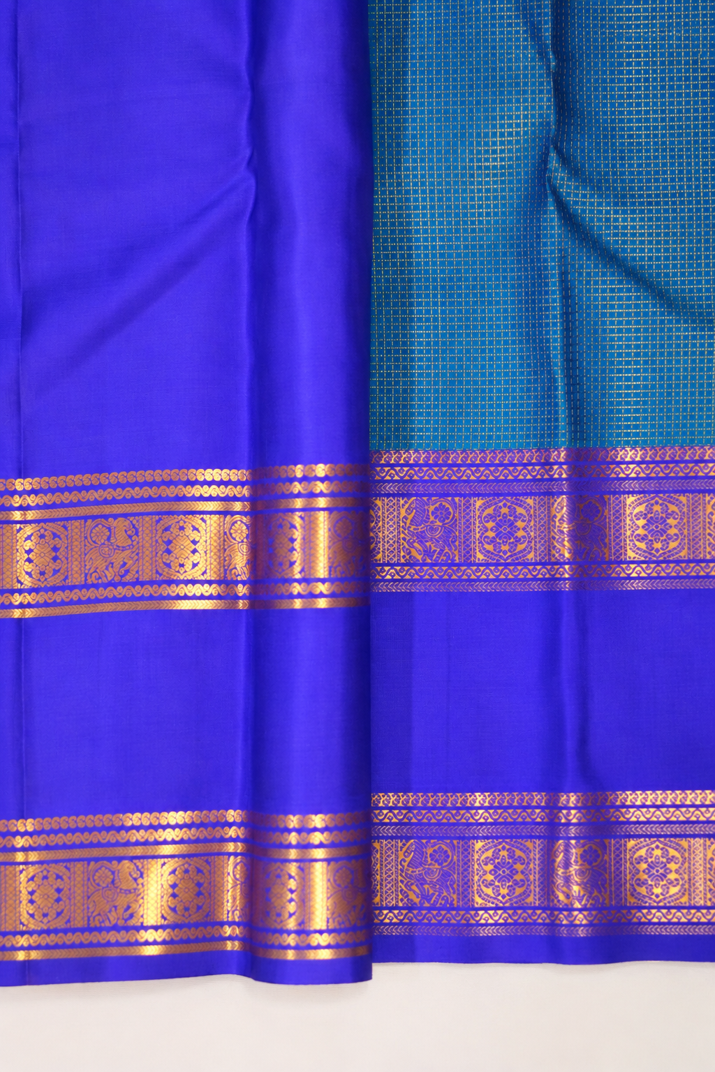 A luxurious royal violet Kanjivaram silk saree paired with a peacock teal pallu