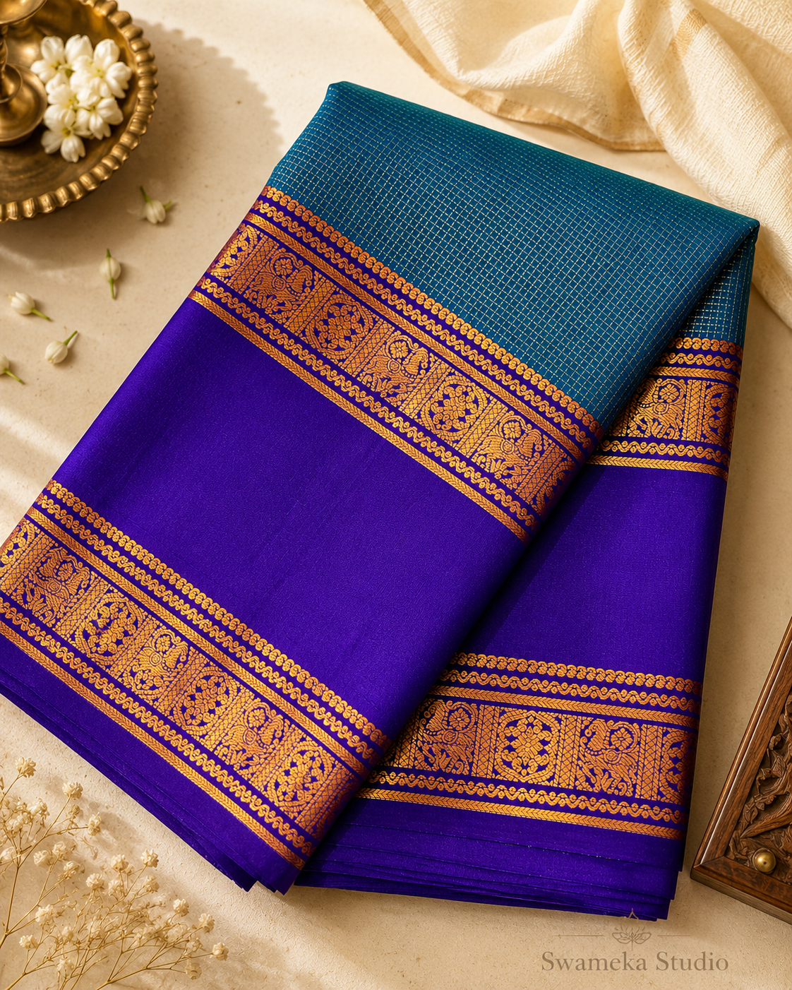 A luxurious royal violet Kanjivaram silk saree paired with a peacock teal pallu