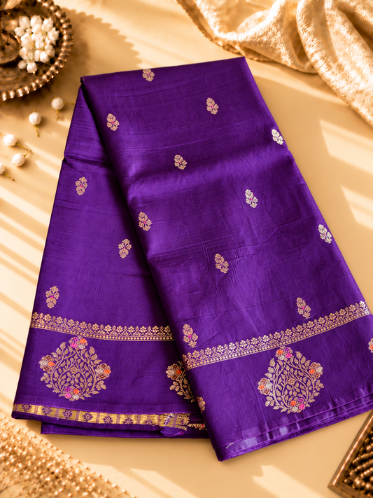A regal Purple Banarasi viscose silk saree featuring intricate Minakari weaving, delicate traditional butis and an ornate floral pallu.