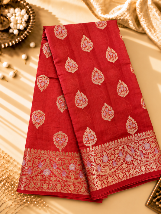 A rich Ruby Red Pure Silk Mark Certified Katan Chiniya Silk Banarasi Saree, featuring intricate traditional Banarasi weaving and elegant Chiniya-inspired motifs.