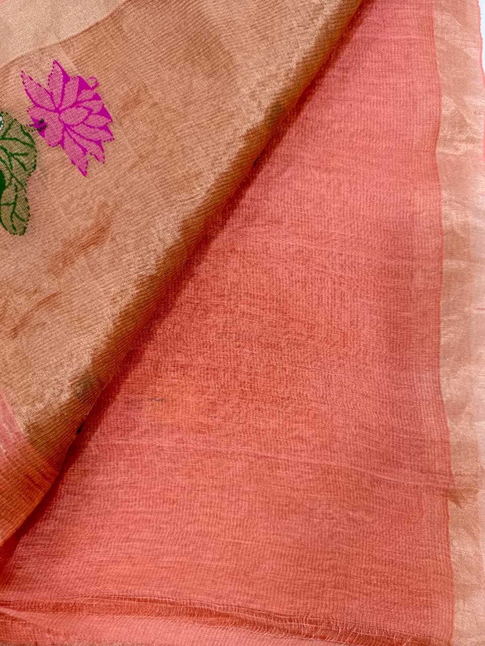 Handwoven Pure Tissue Linen Jamdani in warm burnt orange, adorned with vibrant floral motifs and delicate tissue zari detailing.