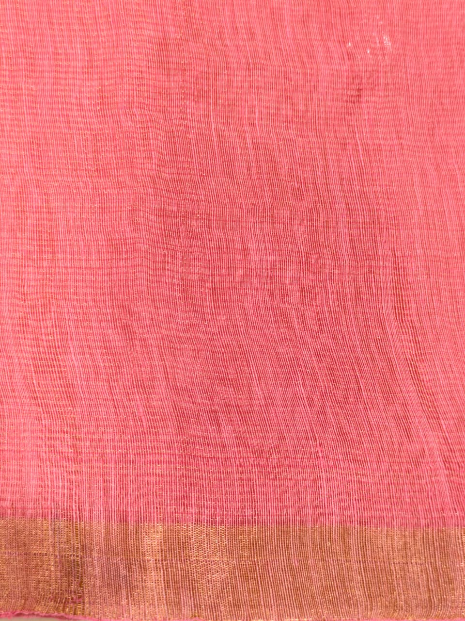 Elegant pastel pink Tissue Linen Jamdani saree with Paithani-style handwoven parrot motifs and delicate golden zari detailing.