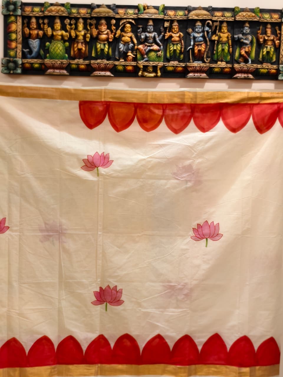 A beautiful hand-painted Durga Parivar design on a cotton saree with contrasting yellow blouse piece