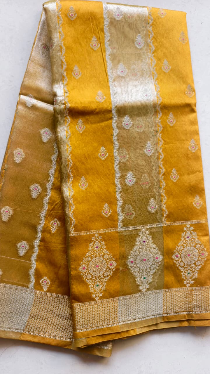 A luxurious Banarasi viscose silk saree in a rich mustard-gold shade, featuring intricate all-over Minakari weaving with delicate pink and green accent