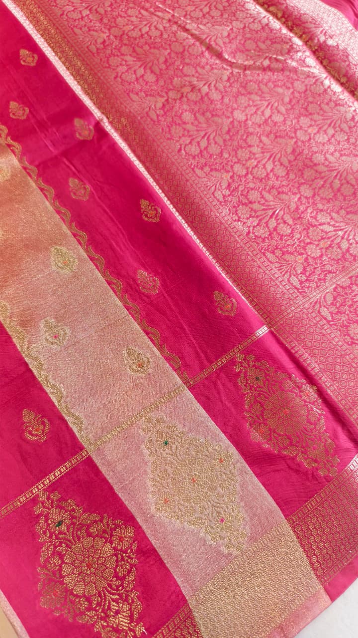 A luxurious Fuchsia Pink Banarasi viscose silk saree featuring intricate all-over Minakari weaving with delicate contrasting accents.
