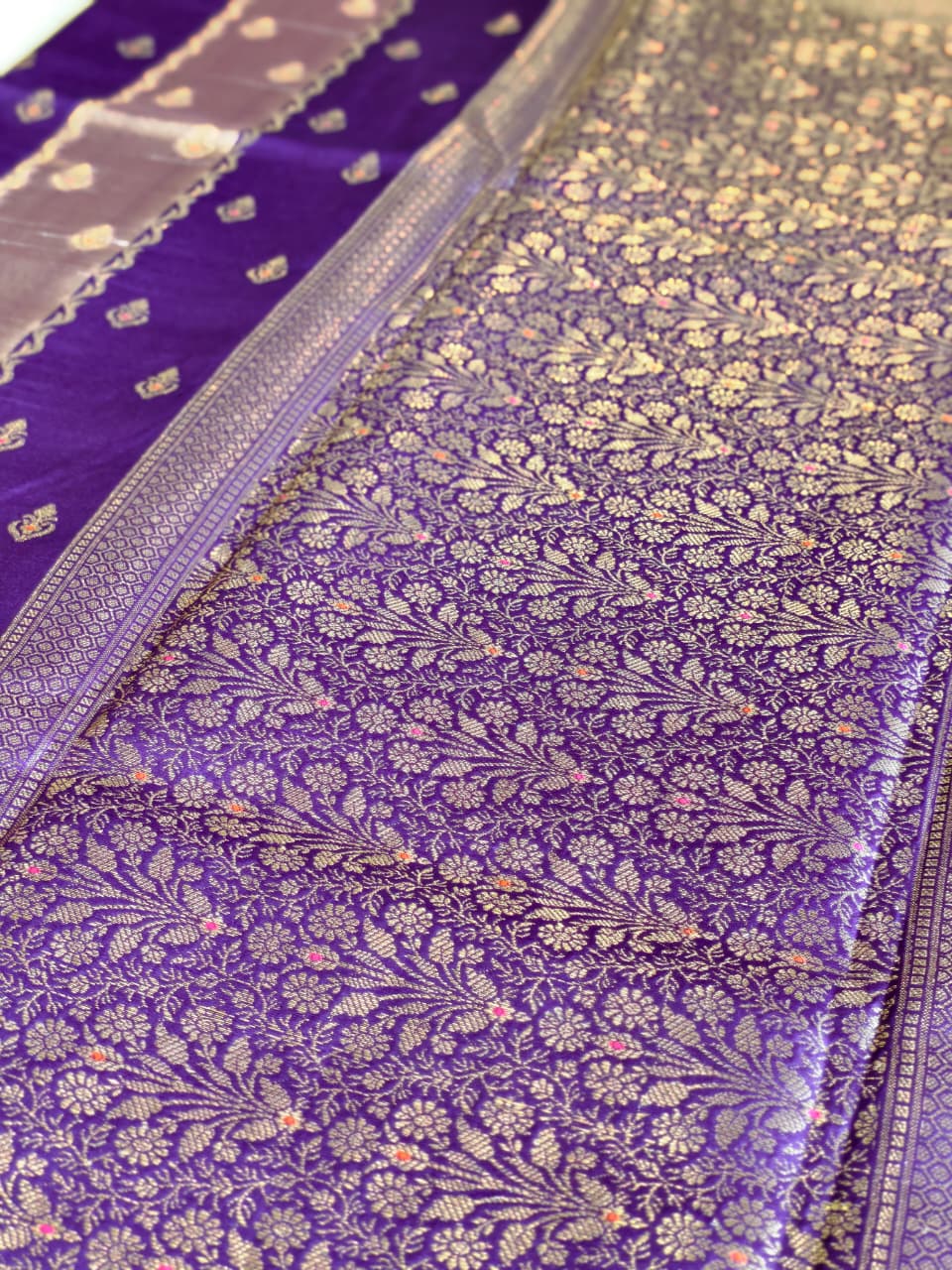 A luxurious Deep Purple Banarasi viscose silk saree featuring intricate all-over Minakari weaving with delicate contrasting accents.