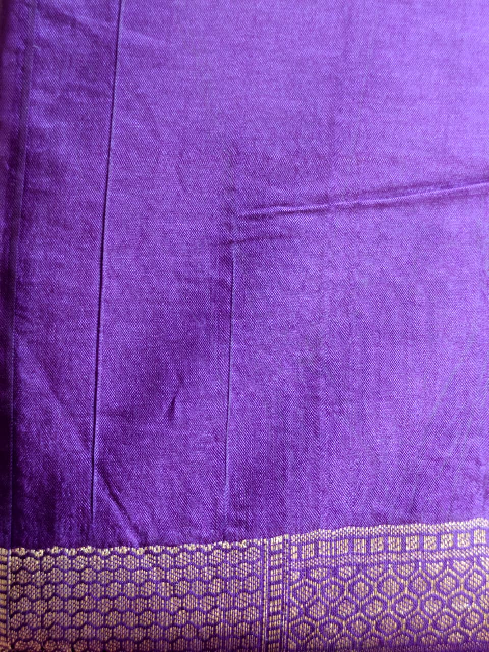 A luxurious Deep Purple Banarasi viscose silk saree featuring intricate all-over Minakari weaving with delicate contrasting accents.