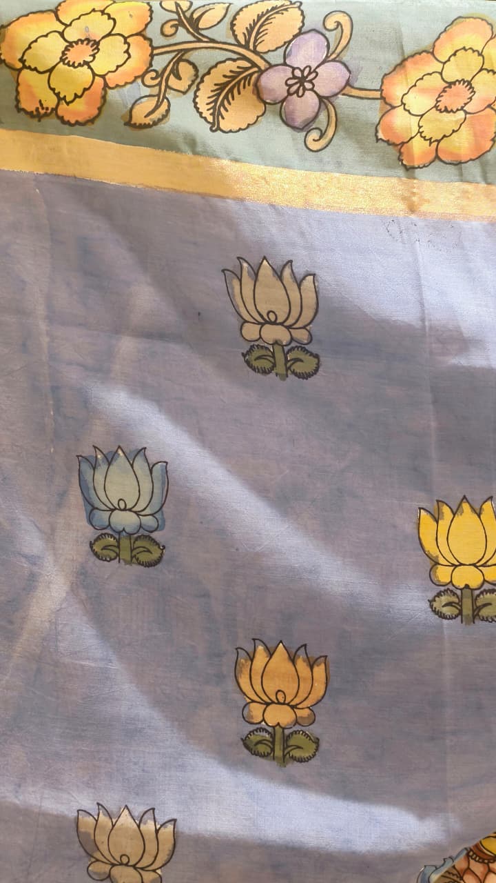 Hand-painted Kalamkari saree in Bangalore Silk featuring Rama & Sita on the body, Krishna & Radha on the pallu, floral borders, and a matching lavendar lotus-motif blouse piece