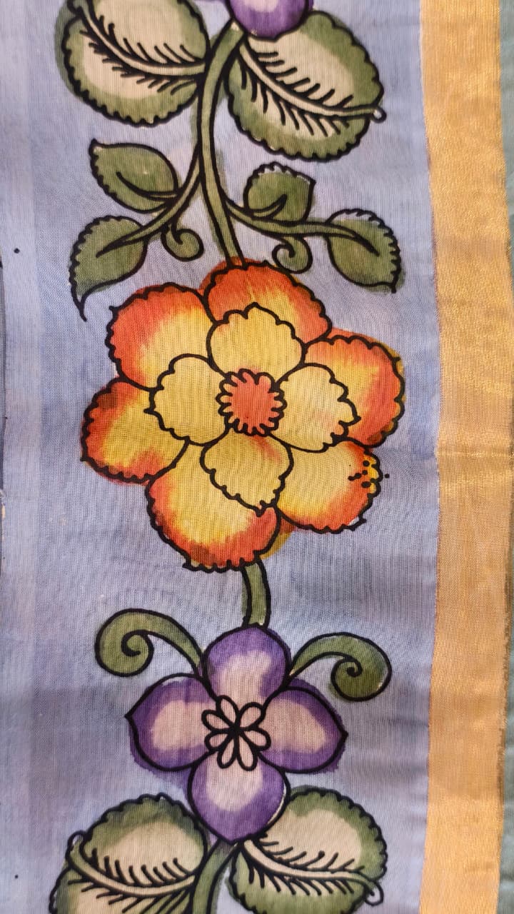 Hand-painted Kalamkari saree in Bangalore Silk featuring Rama & Sita on the body, Krishna & Radha on the pallu, floral borders, and a matching lavendar lotus-motif blouse piece