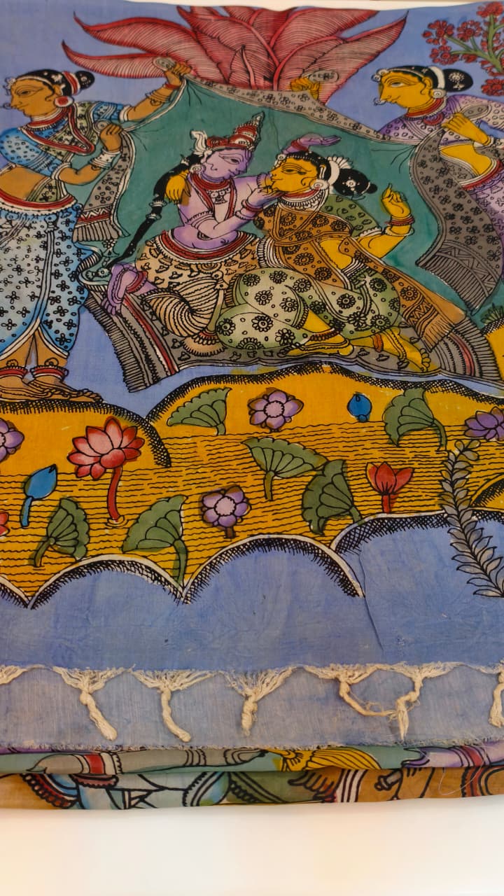 Hand-painted Kalamkari saree in Bangalore Silk featuring Rama & Sita on the body, Krishna & Radha on the pallu, floral borders, and a matching lavendar lotus-motif blouse piece